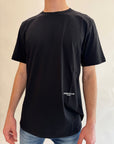 T-shirt Underclub verde salvia, nero o latte con logo sul retro